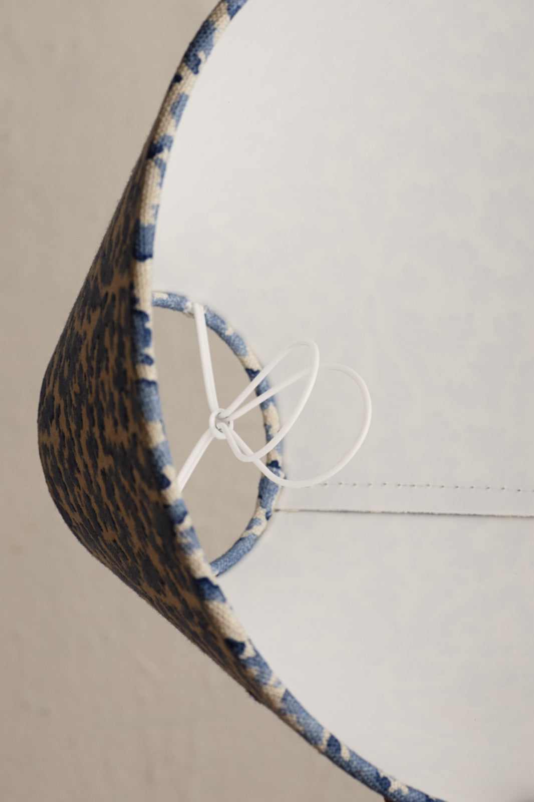 A bulb clip inside a lampshade, seen from below